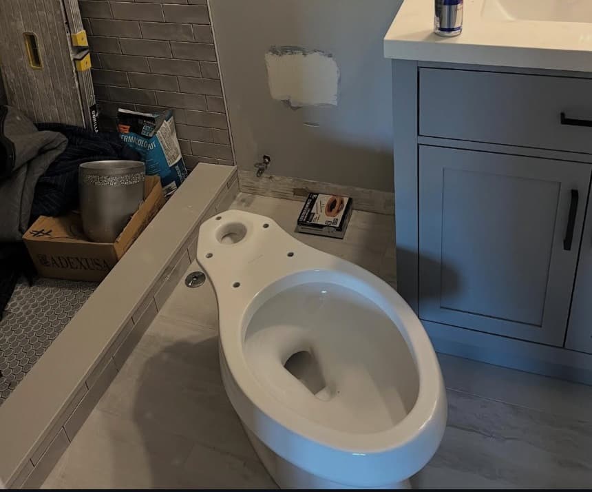 Before plumbing work - showing outdated or damaged plumbing fixtures